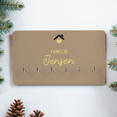 Personligt nøglebræt med tekst og symbol